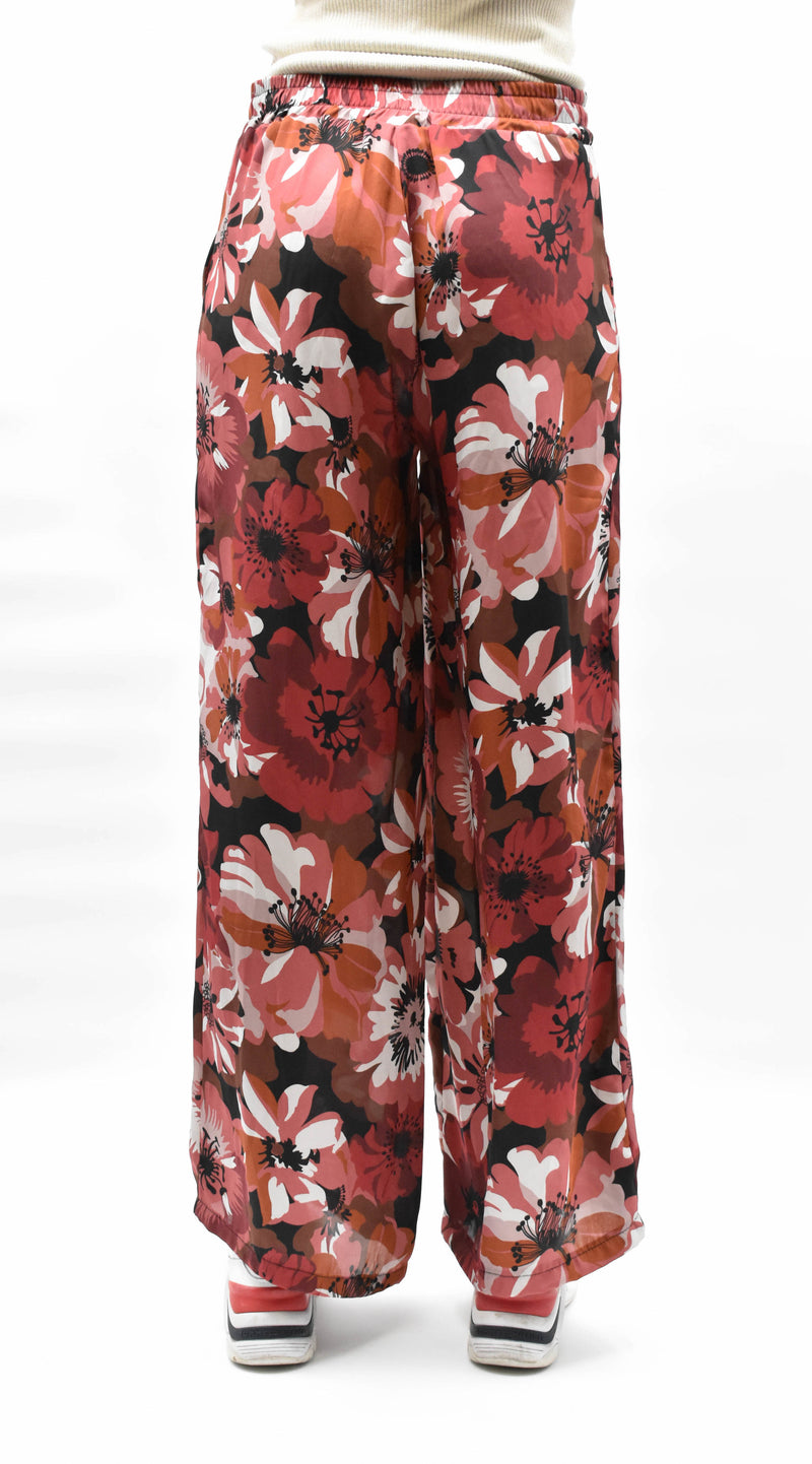 BROEK ROZE BLOEMEN MET WIJDE PIJPEN EN BLOEMEN PRINT